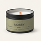 Candle in a black tin labeled 'Mossy' on a white background