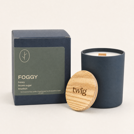Navy candle with wooden lid and packaging labeled 'FOGGY' on a white background