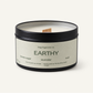 Candle with 'Earthly' label on a white background