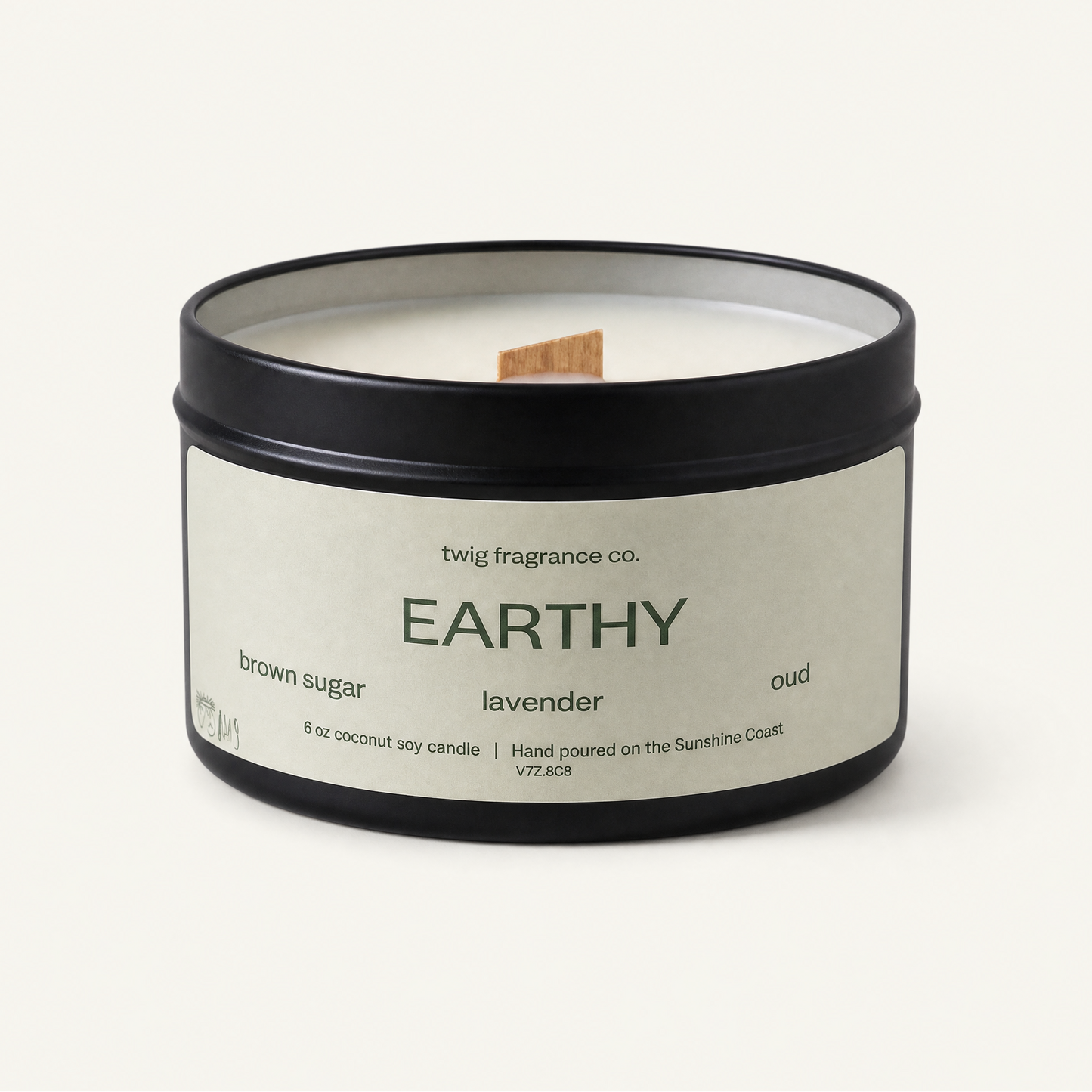 Candle with 'Earthly' label on a white background