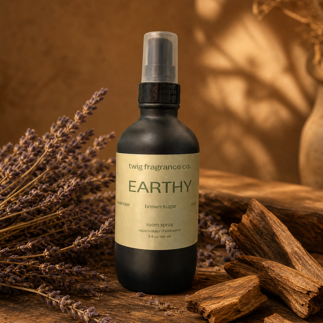 lack spray bottle labeled 'Earthy' on a wooden surface with lavender and wood pieces.